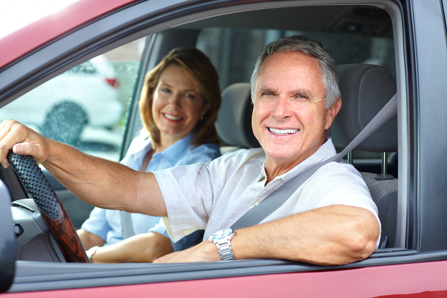 Elderly couple in car.