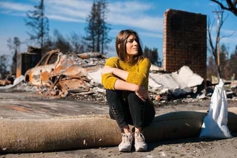 photo of woman sitting in front of destroyed home feeling despair ID 122117345 © Vlad Teodor | Dreamstime.com